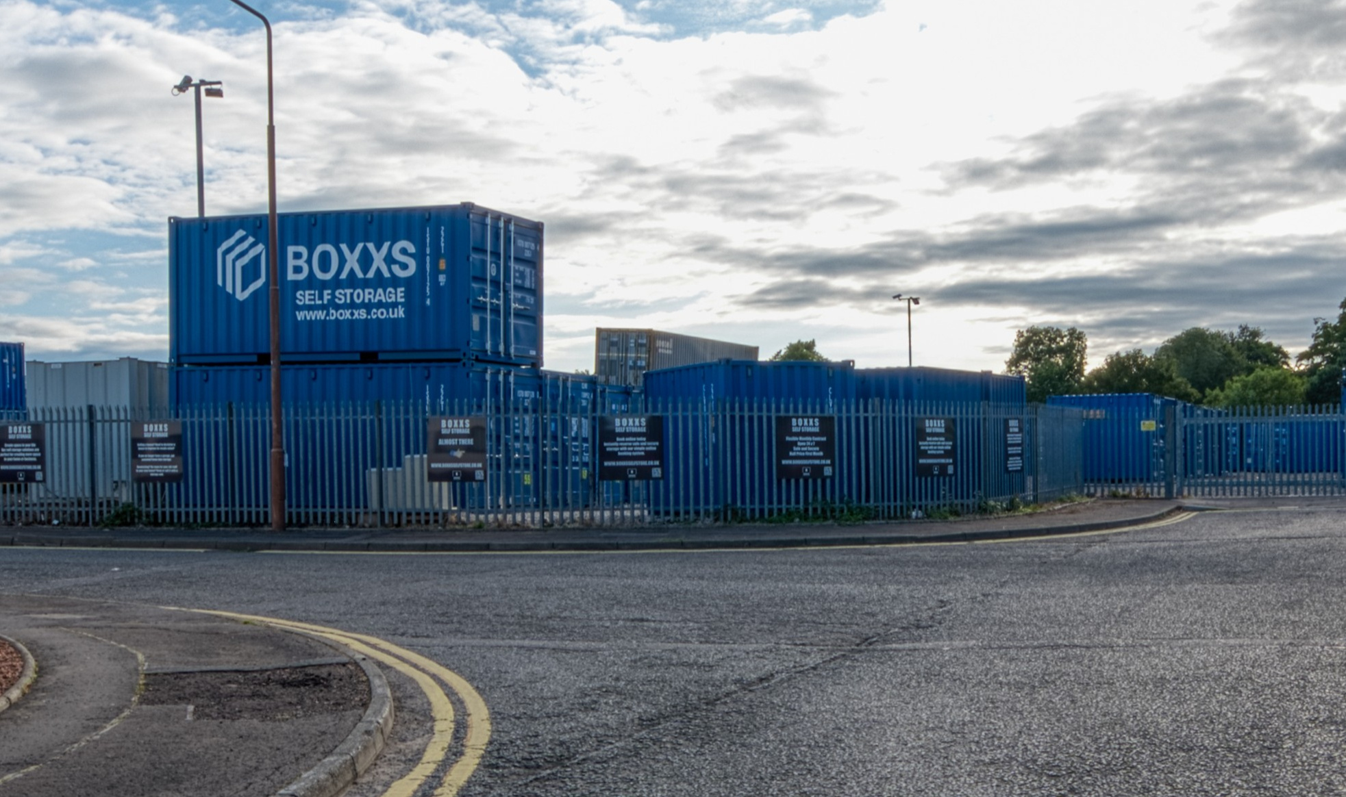 Boxxs self storage entrance with branded container at Linlithgow Alternate angle of Boxxs self storage container with painted logo at the Linlithgow entrance, highlighting secure access for Polmont and Falkirk customers